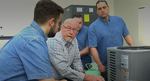 Teacher and Students at Trade School